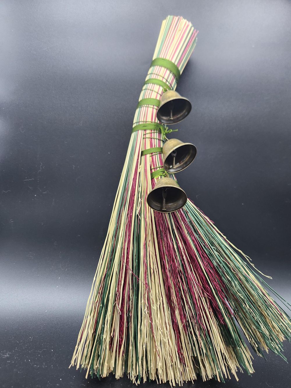 Red and green handmade broom