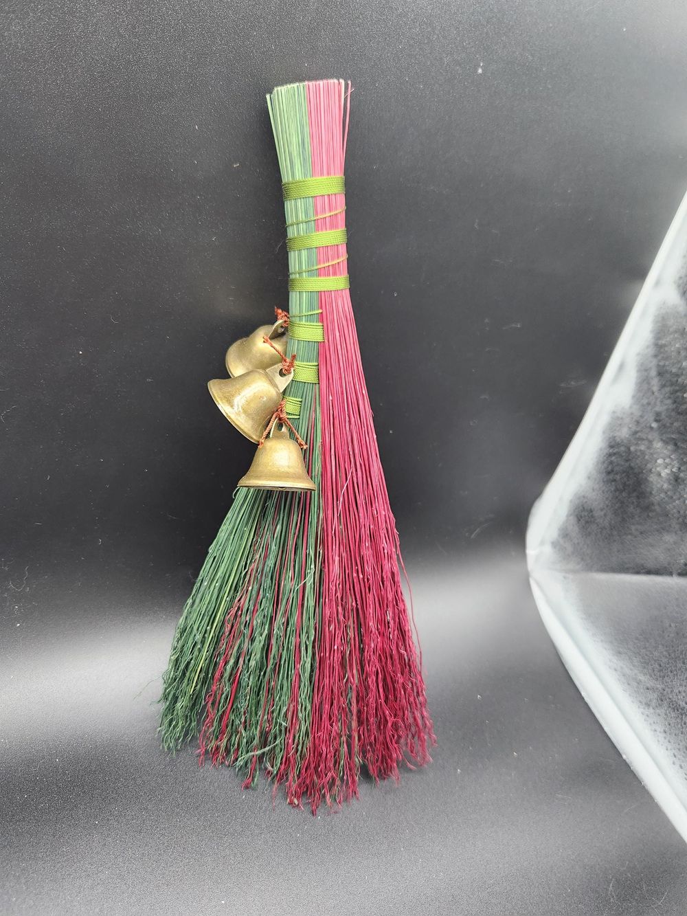 Red and green handmade broom