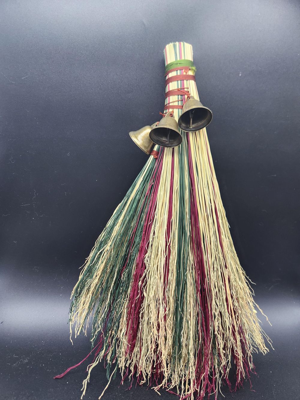 Red and green handmade broom