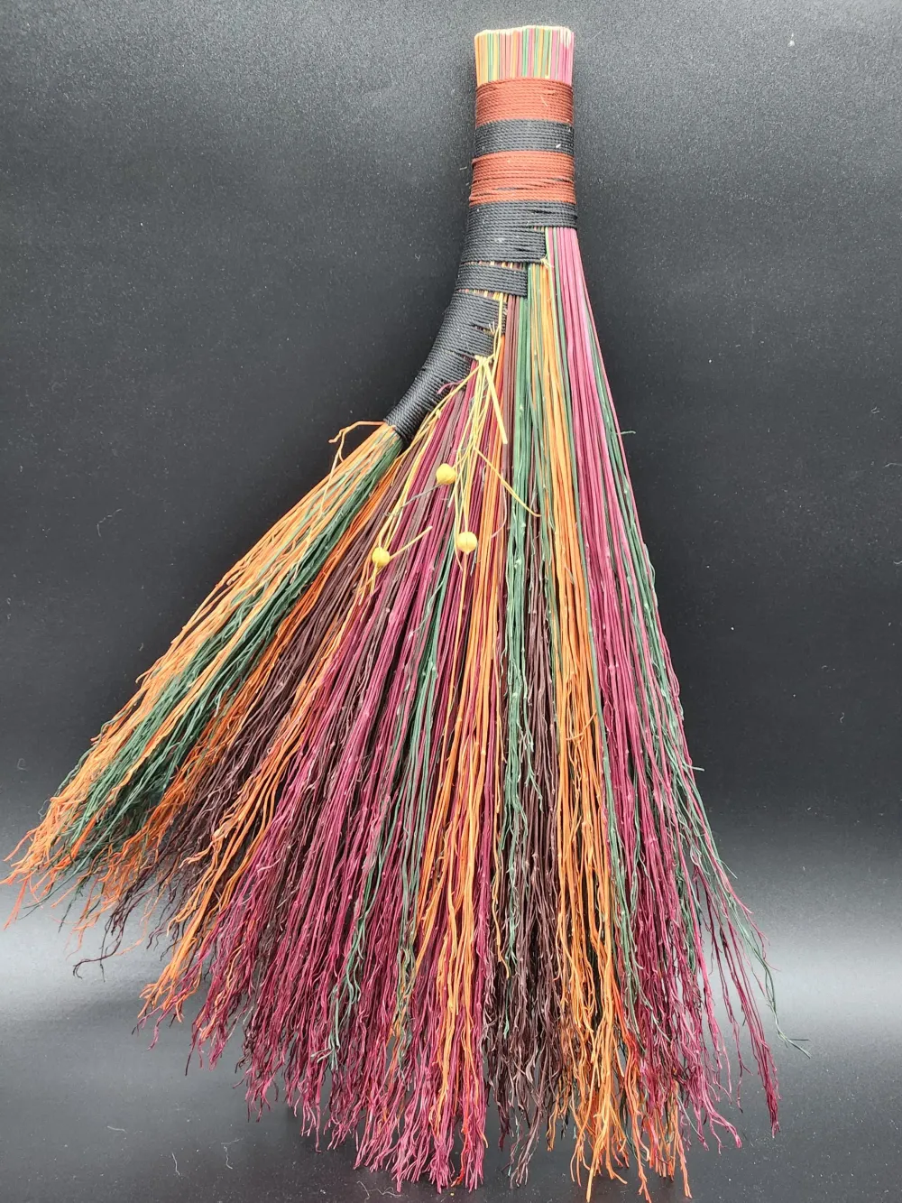 Handmade broom with autumn colors